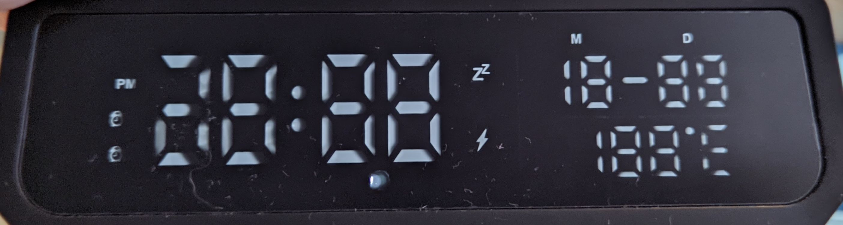 All display segments light up at the same time showing PM, alarm, snooze, etc. symbols